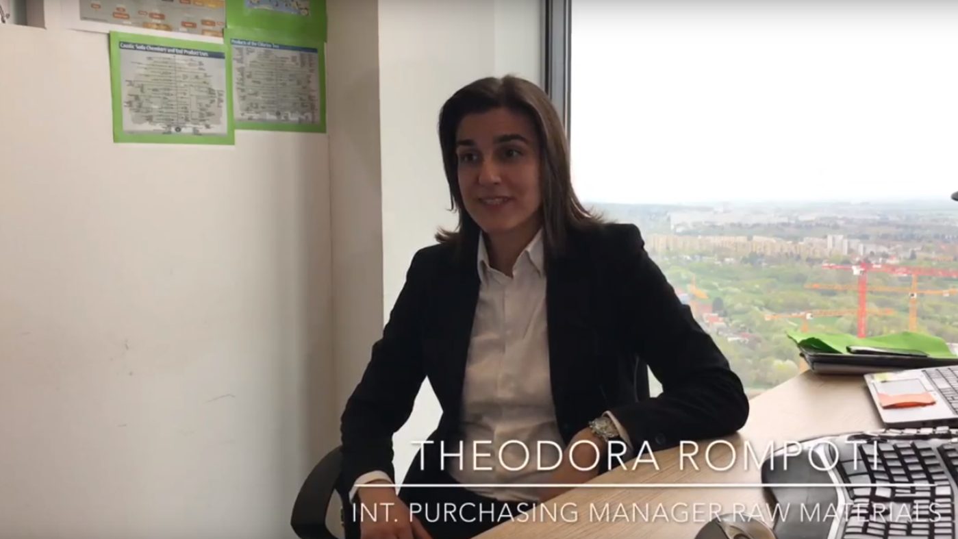 woman in an office, talking, desk
