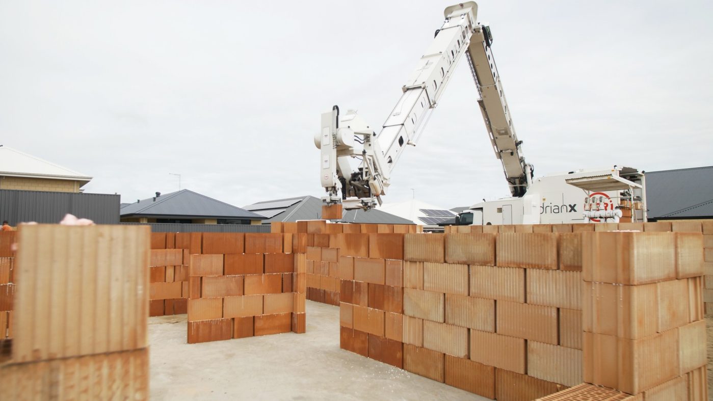 Robots builds brick house