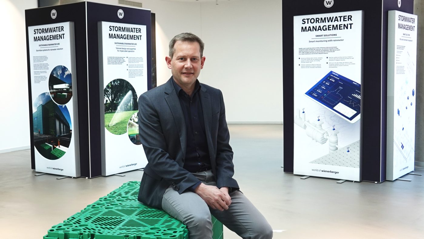 Ulrich Bohle, Category Manager at Pipelife sitting on a stormwater box
